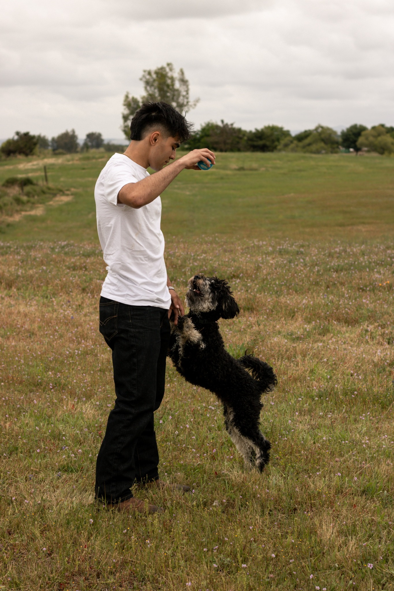 Nick Saavedra, founder of High Shine Exterior Cleaning, with his dog Oakley